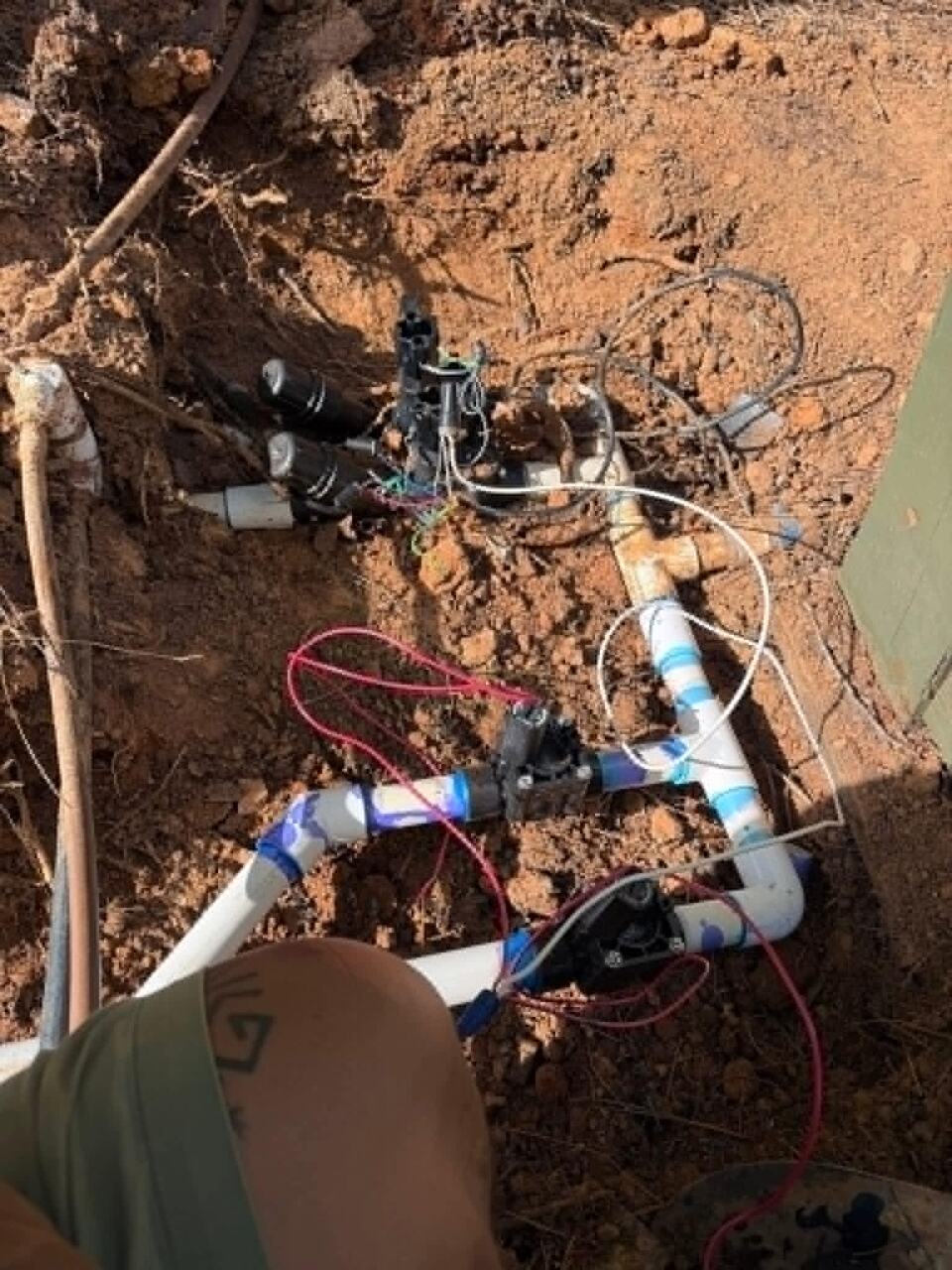 Trench opened to access underground water control piping