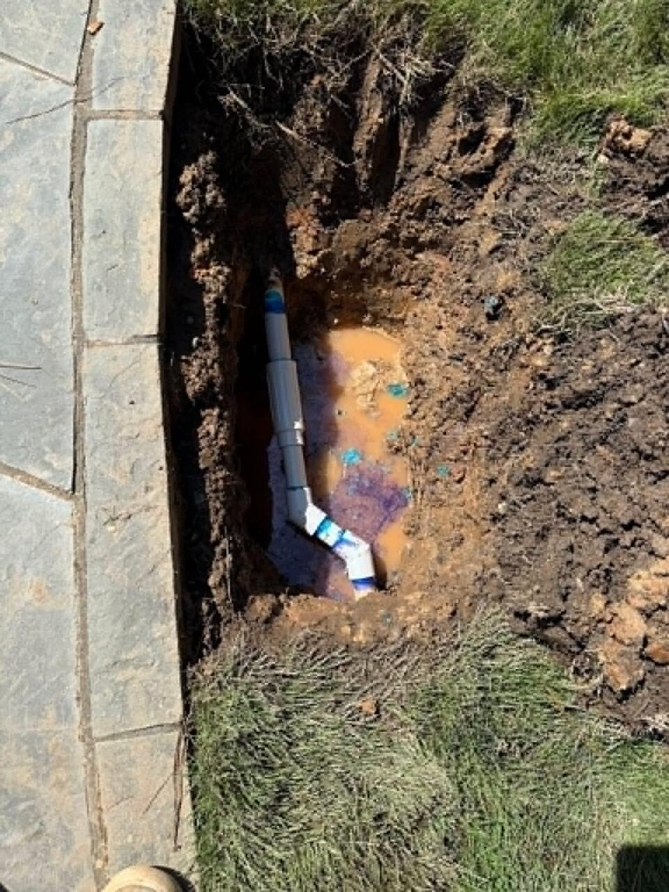 Close view of repaired irrigation valves and control wiring
